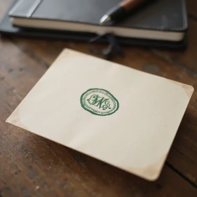 Editorial seal monogram for Seattle Foundation Repair on a warm cream background